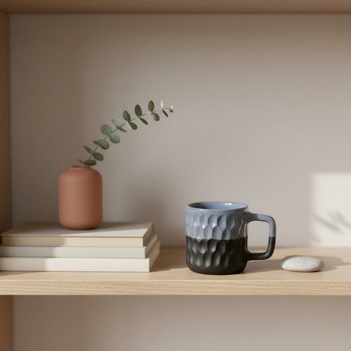 Eternal Pottery two-tone blue and charcoal ceramic mug with geometric texture and comfortable handle.