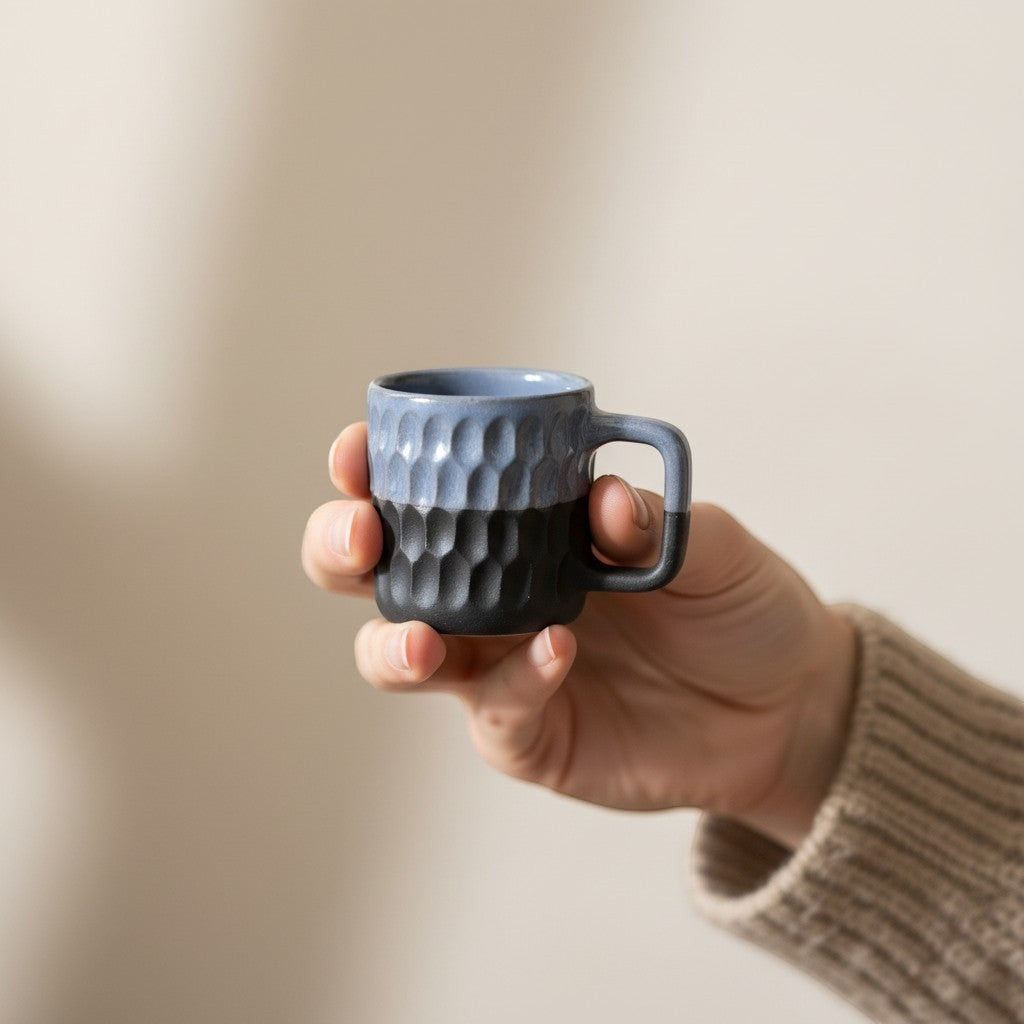 Eternal Pottery blue and charcoal textured ceramic coffee mug with geometric pattern and comfortable handle.