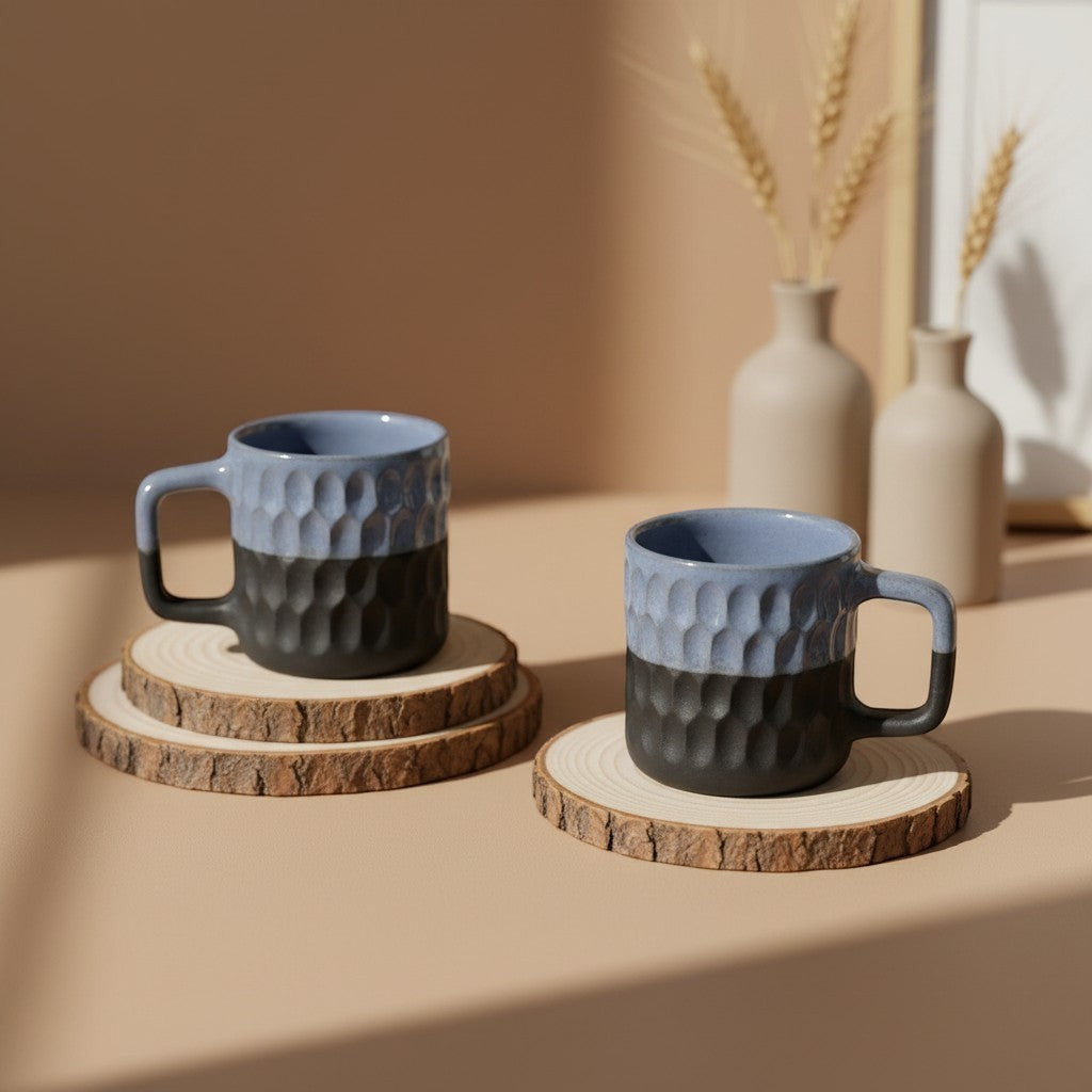 Eternal Pottery two-tone blue and charcoal ceramic mug with geometric texture and comfortable handle.