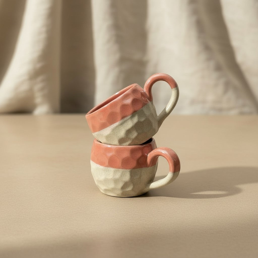 Eternal Pottery textured ceramic coffee mug in coral and beige with a comfortable handle, perfect for espresso or tea.