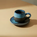 Eternal Pottery artisan ceramic espresso cup and saucer set with blue and black matte glaze. Stoneware coffee cup with handle.