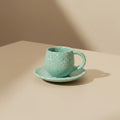 Eternal Pottery speckled mint sand ceramic espresso cup and saucer set, perfect for small coffee servings.